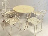 four chairs and a table that are sitting on the floor