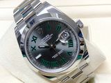 the rolex watch is in a box with a green roman numeral on it