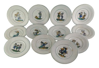 many plates with cartoon characters on them on a white surface