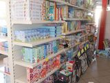many shelves of toys in a store with toys on them