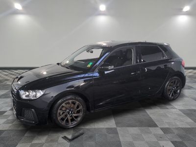 a picture of a black car parked in a garage