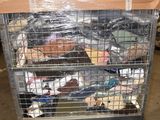 a cart with a lot of clothes in it