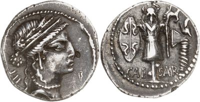 a silver coin with an image of a woman on it