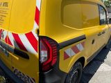 a yellow van that is parked on the side of the road