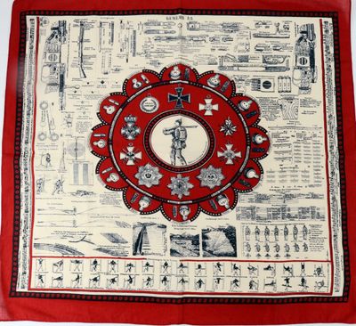 a close up of a red and white banda with a picture of a person on it