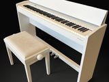 a white piano and a stool on a black background