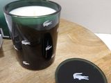 a glass of milk next to a keyboard on a table