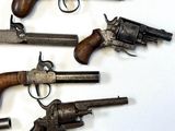 a lot of old guns that are on the table