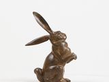 bronze sculpture of a rabbit sitting on its hind legs