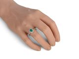 a close up of a person ' s hand with a ring on it