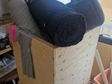a wooden box that has some blankets on top of it