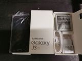a box with a phone inside of it on a table