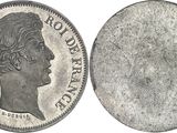 a close up of a coin with a woman ' s face on it
