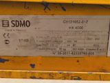 a label on the back of a yellow machine