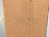 someone is holding a cardboard box with a drawing of a clock on it