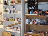 a room that has a lot of clutter on the shelves