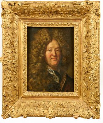 portrait of a man with curly hair in a gold frame