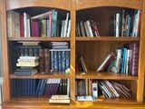 a book shelf with many books on top of it