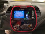 the dashboard of a car with a gps device in the center of it