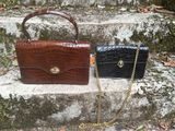 two purses that are sitting on some steps