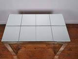 an image of a glass table with four squares on top of it