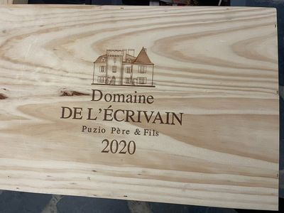a wooden box with a picture of a house on it