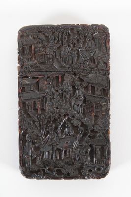 an image of a carved box with a scene of a city on it