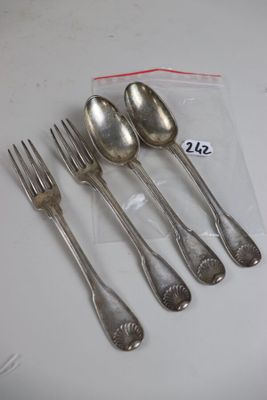 six forks and spoons sitting on a table with a price tag