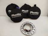 two black phototux lens hoods and a black lens case