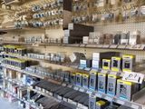 many electronic devices on the shelves in the store