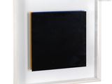 an image of a black and yellow painting in a white frame