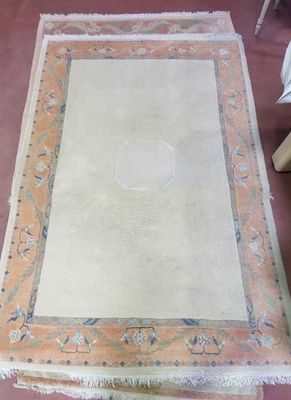 a rug on the floor with a picture frame on it