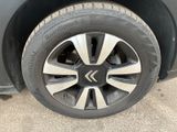 the tire of a car with a flat tire is shown