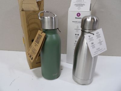 two water bottles sitting next to each other on a table