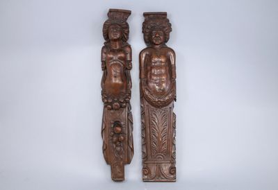 pair of carved wood figures of a man and a woman