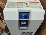 an image of a white machine sitting on top of a pile of boxes