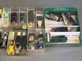 a lot of different toy trains and cars in the box