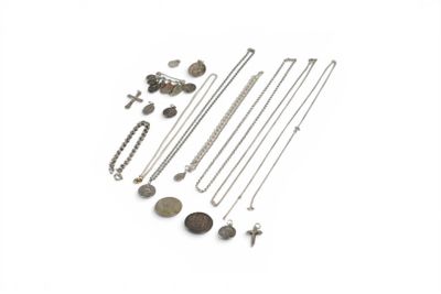 several different types of necklaces and earrings on a white surface
