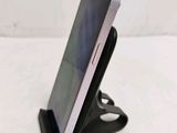 a cell phone that is sitting on top of a stand