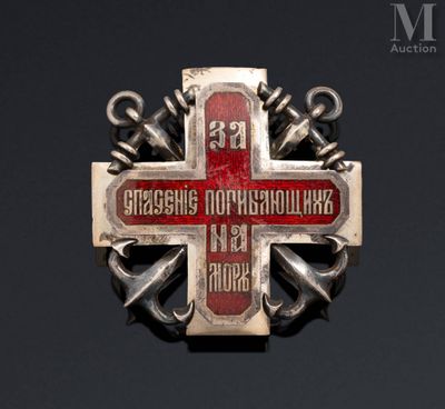 a red and white cross with anchors on it