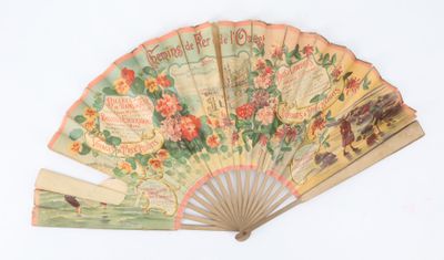 un vieux ventilateur orné de fleurs, posé sur un fond blanc