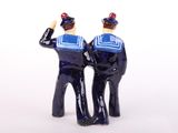 two figurines of two police officers standing next to each other