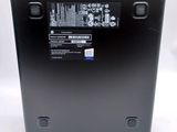 the back of a black laptop with a battery on top of it
