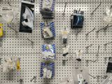 a display of electronics on the wall in a store