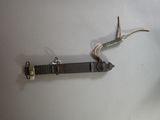 a small piece of electrical wire attached to a wall