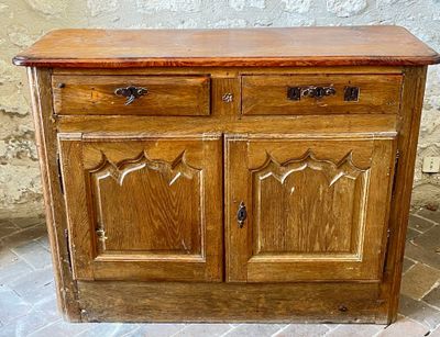 a wooden cabinet with two drawers and a door