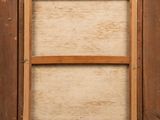 an old picture of a window with a wooden frame on the outside of it