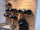 a display of helmets on the wall in a store