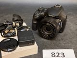 a sony camera and a charger sitting on a table
