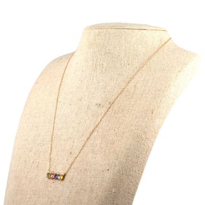 the necklace is made of gold and multicolored stones